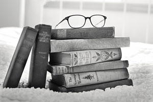 Stack of Books With Reading Glasses On Top